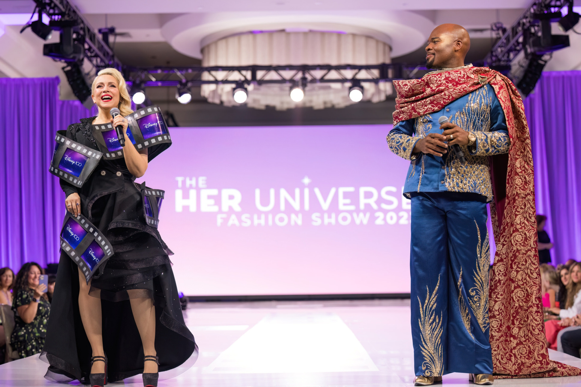 Her Universe Fashion Show hosts Ashley Eckstein and Michael James Scott.