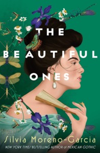 Cover for Silvia Moreno-Garcia's The Beautiful Ones. A light skinned woman is in profile across the cover. Her black hair is tied up and she is holding a foldable hand to her neck. Mixing colors of green and blue.