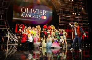 Photo of several people performing on stage at the 2023 Olivier Awards