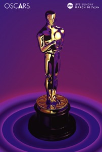 Photo of an Oscar statuette against in purple background. 