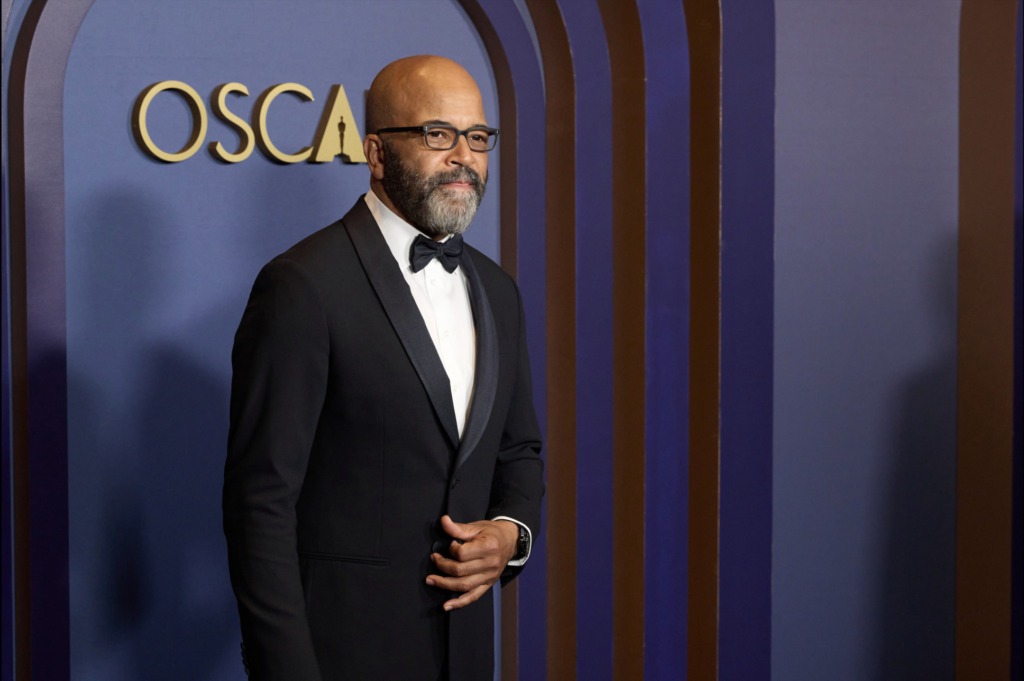 Jeffrey Wright wearing glasses and a tuxedo.