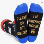 A picture of black, red, and blue socks that say "Please do not disturb, I'm watching movies"