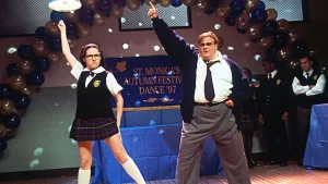 Woman and Man doing a disco dance move in a school gym 