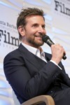 Picture of Bradley Cooper talking into a microphone