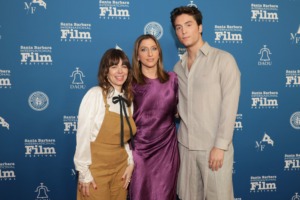 Photo of Natasha Leggero, Chelsea Peretti, and Benito Skinner on a red carpet. 