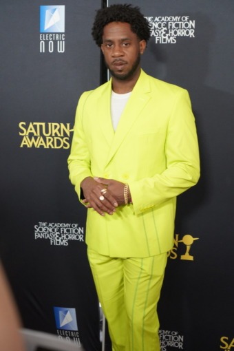 photo of a man posing on a red carpet