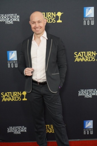 photo of a man posing on a red carpet