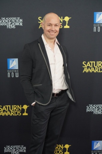 photo of a man posing on a red carpet