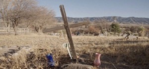 picture of a cross on a gravesite 