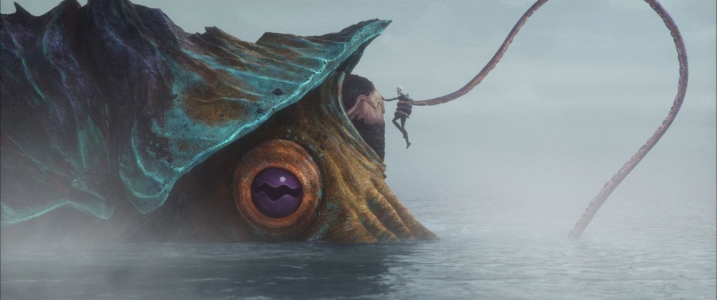 A vrathean, a large sea creature with a hard shell, at least three eyes, and long tentacles, holds Ventress up to its face.