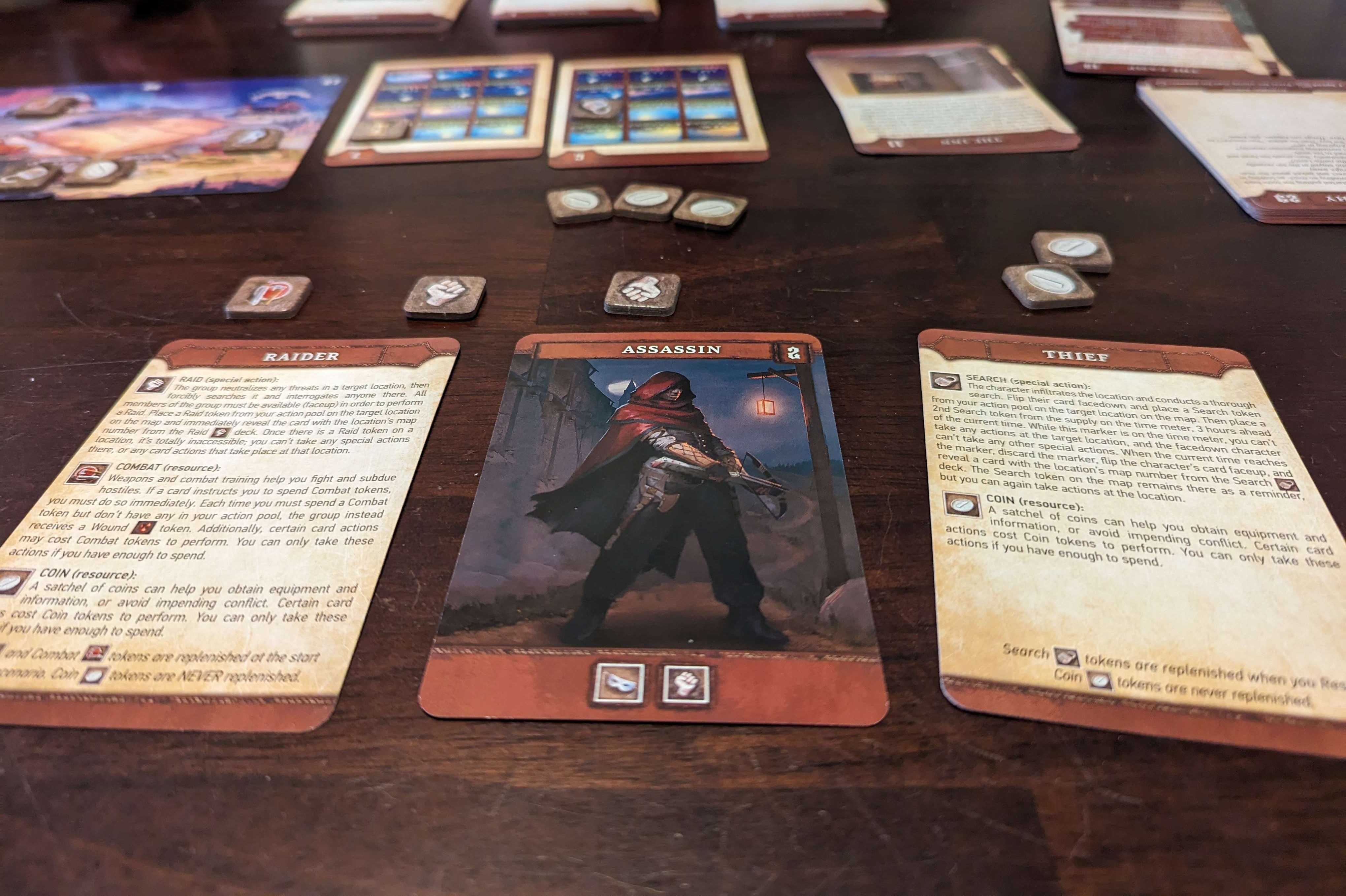 "Mortum: Medieval Detective" at play on a wooden table. Character card "thief" is face up.