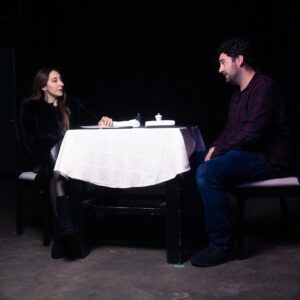 Picture of a woman and a man sitting at a table 