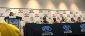 Panelists for Wondercon Panel "Gaming for Social and Cultural Reflection" sitting at panel