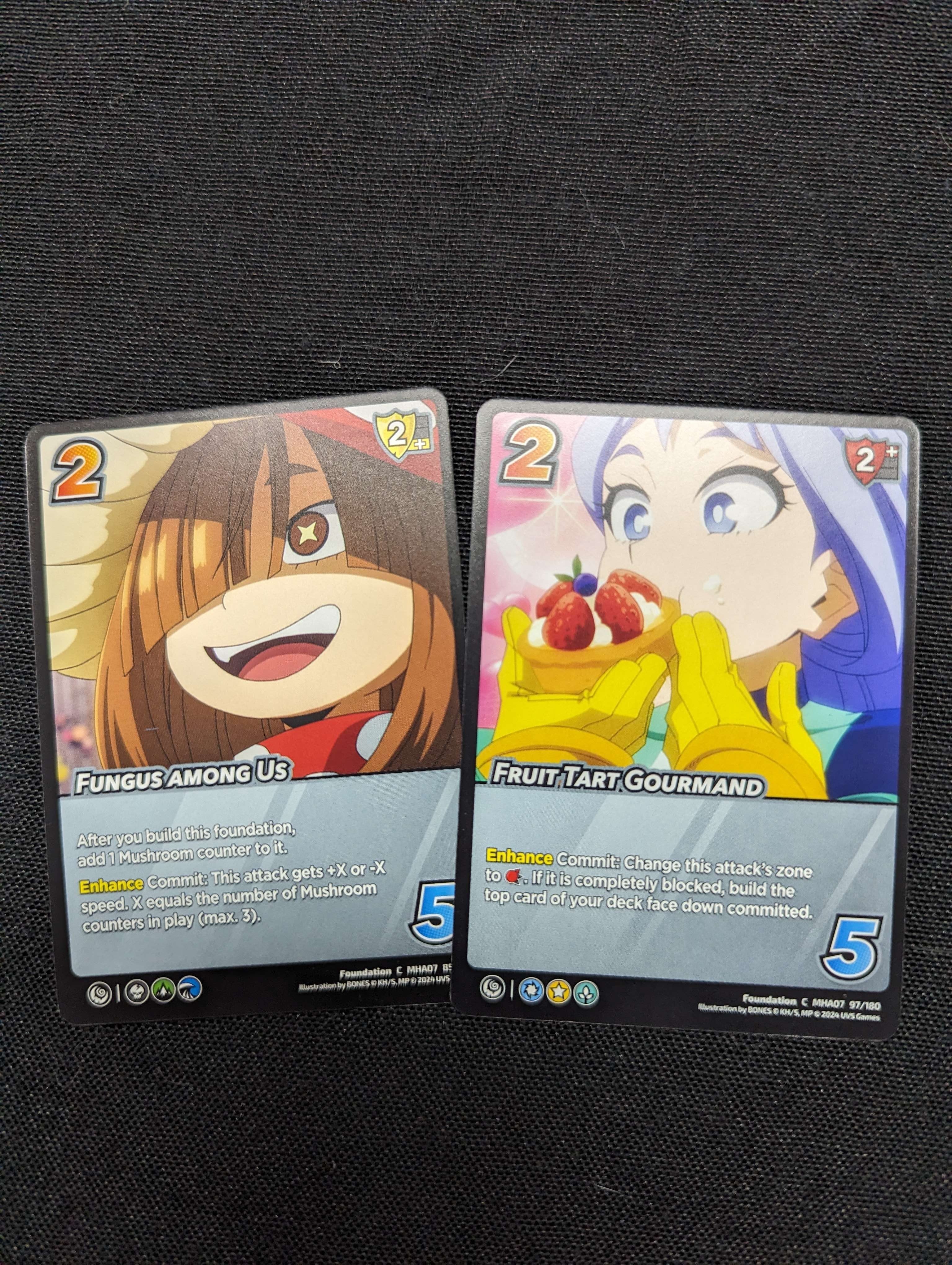 Cards from the UniVersus “My Hero Academia: Girl Power” series, illustrating main characters from the anime. Featuring action and character cards.