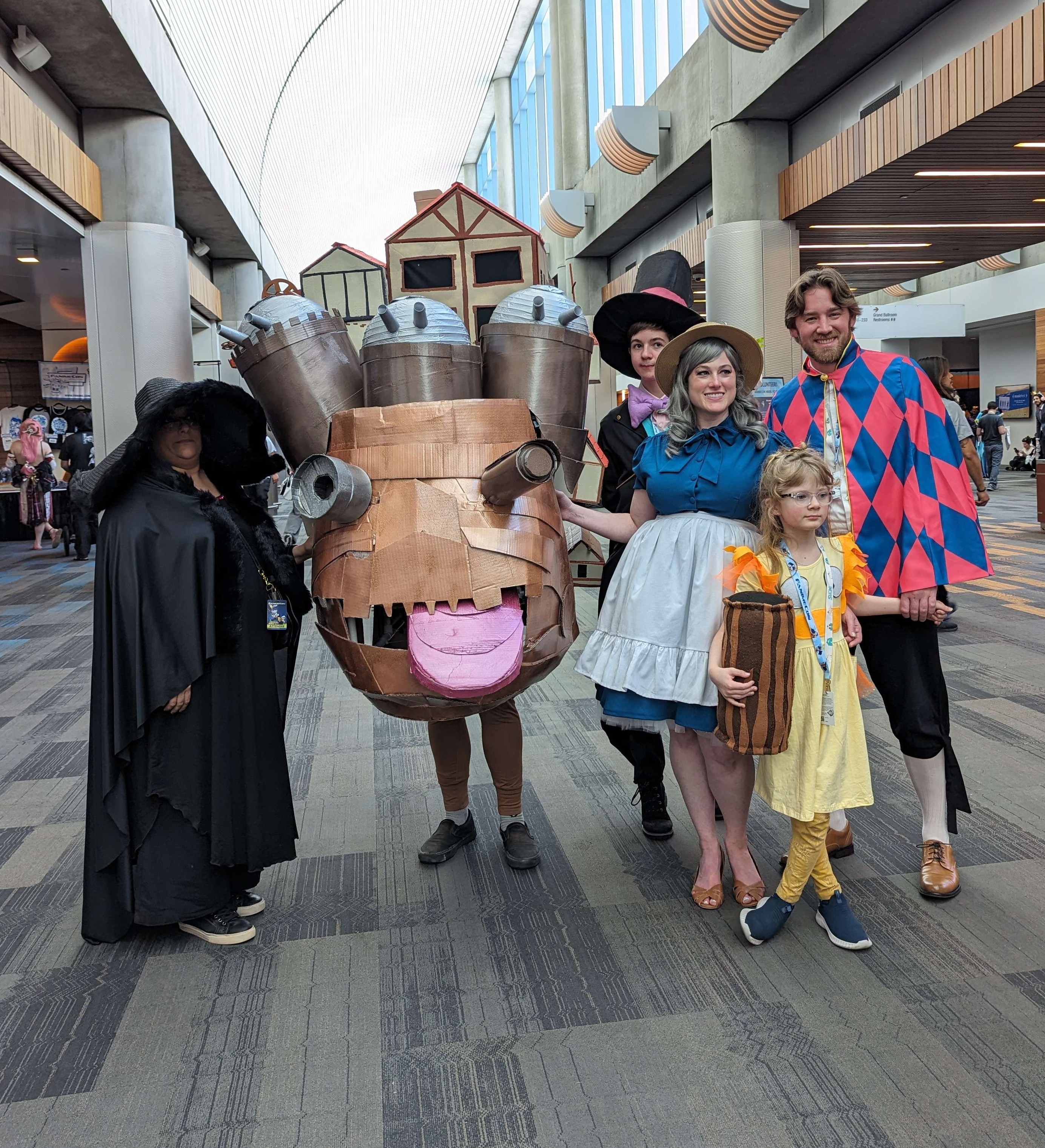 Cosplayers dressing up as Howls Moving Castle characters at Fanime inside the convention center