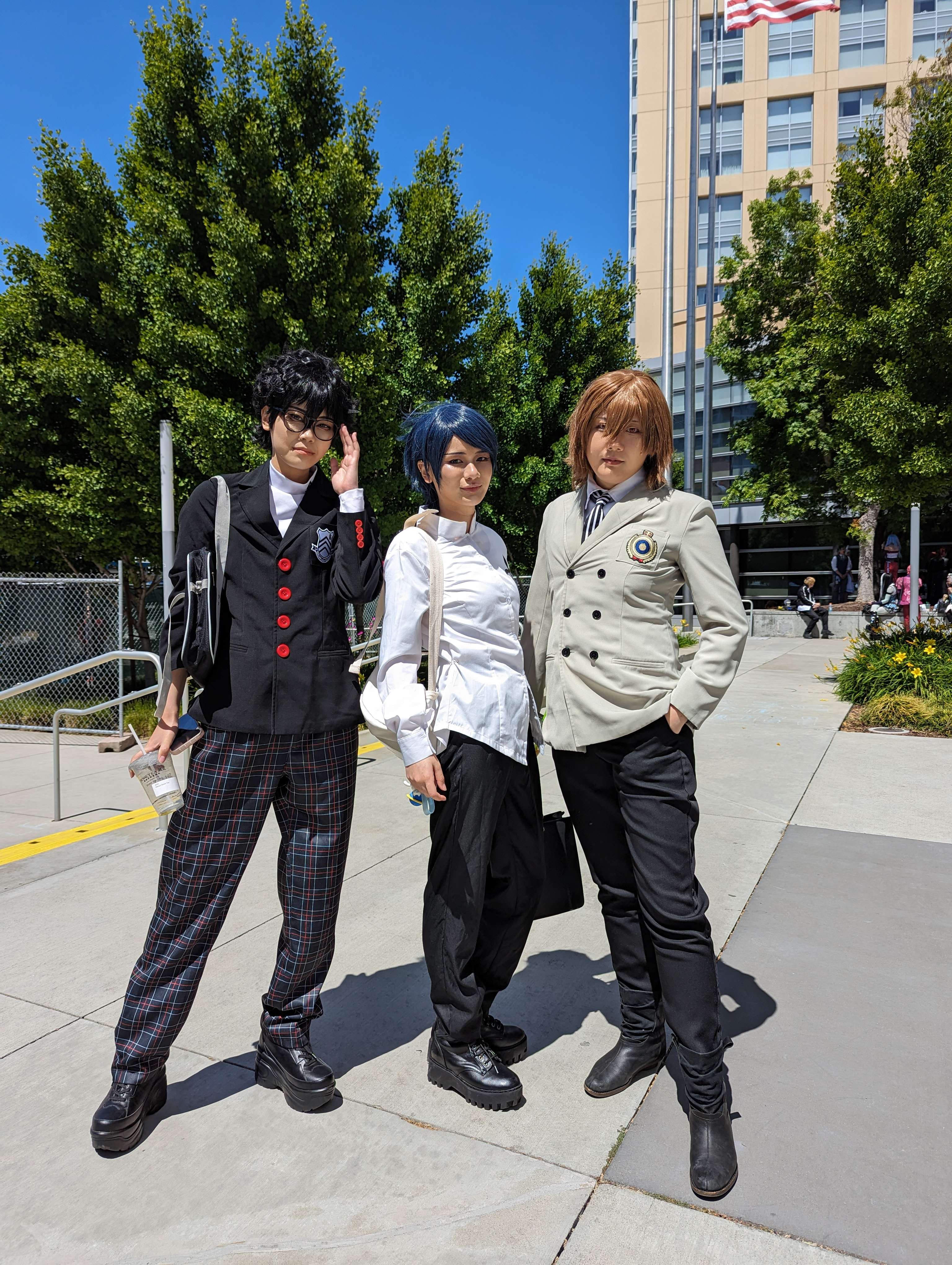 Cosplayers dressing up as Persona 5 characters at Fanime outside the convention center