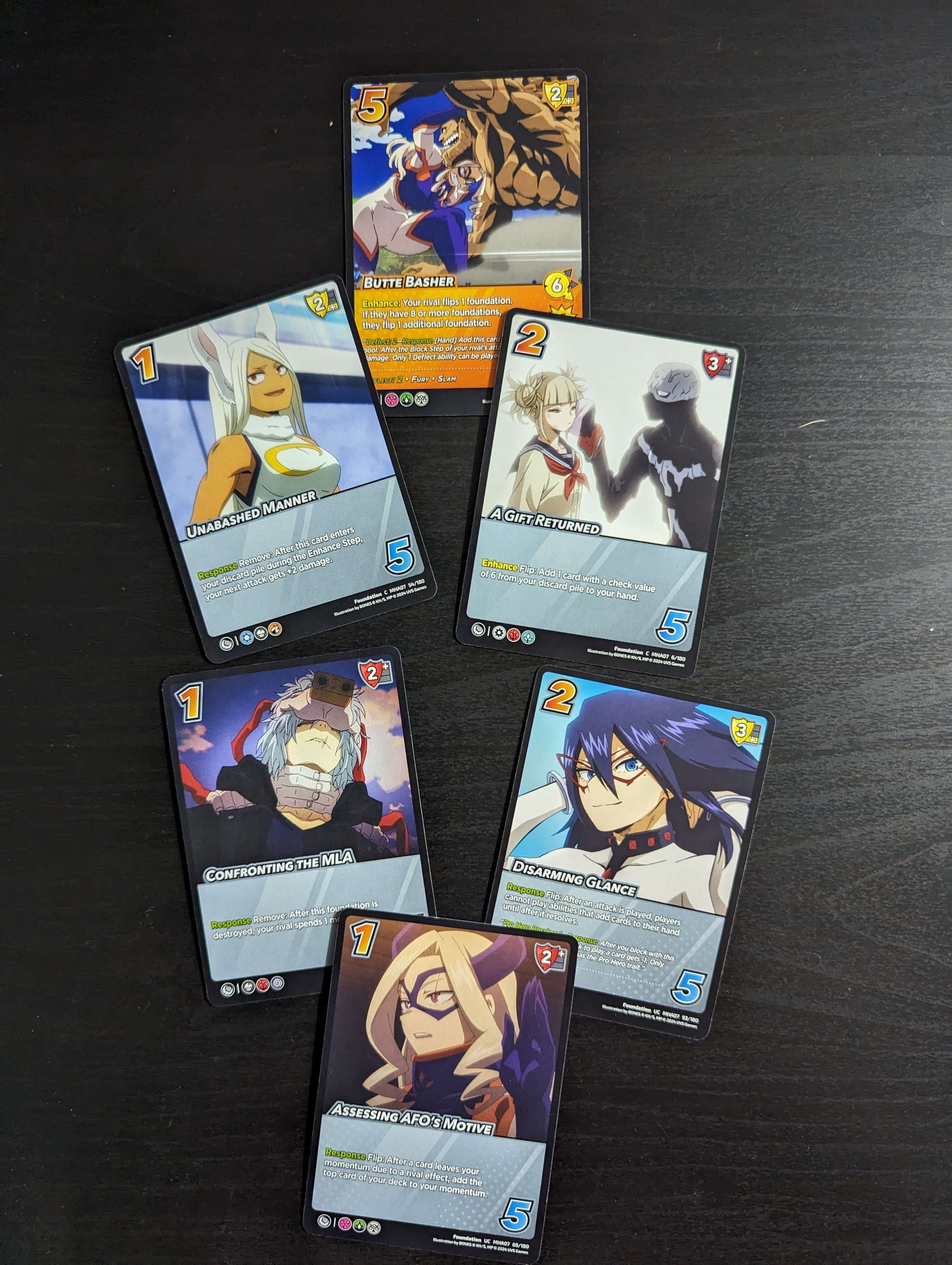 Cards from the UniVersus “My Hero Academia: Girl Power” series, illustrating main characters from the anime. Featuring action and character cards.