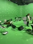 picture of green screen and orchestra set up