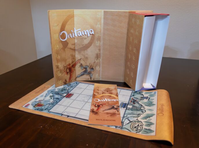 Board Game laid out on table displaying game mat and booklet.