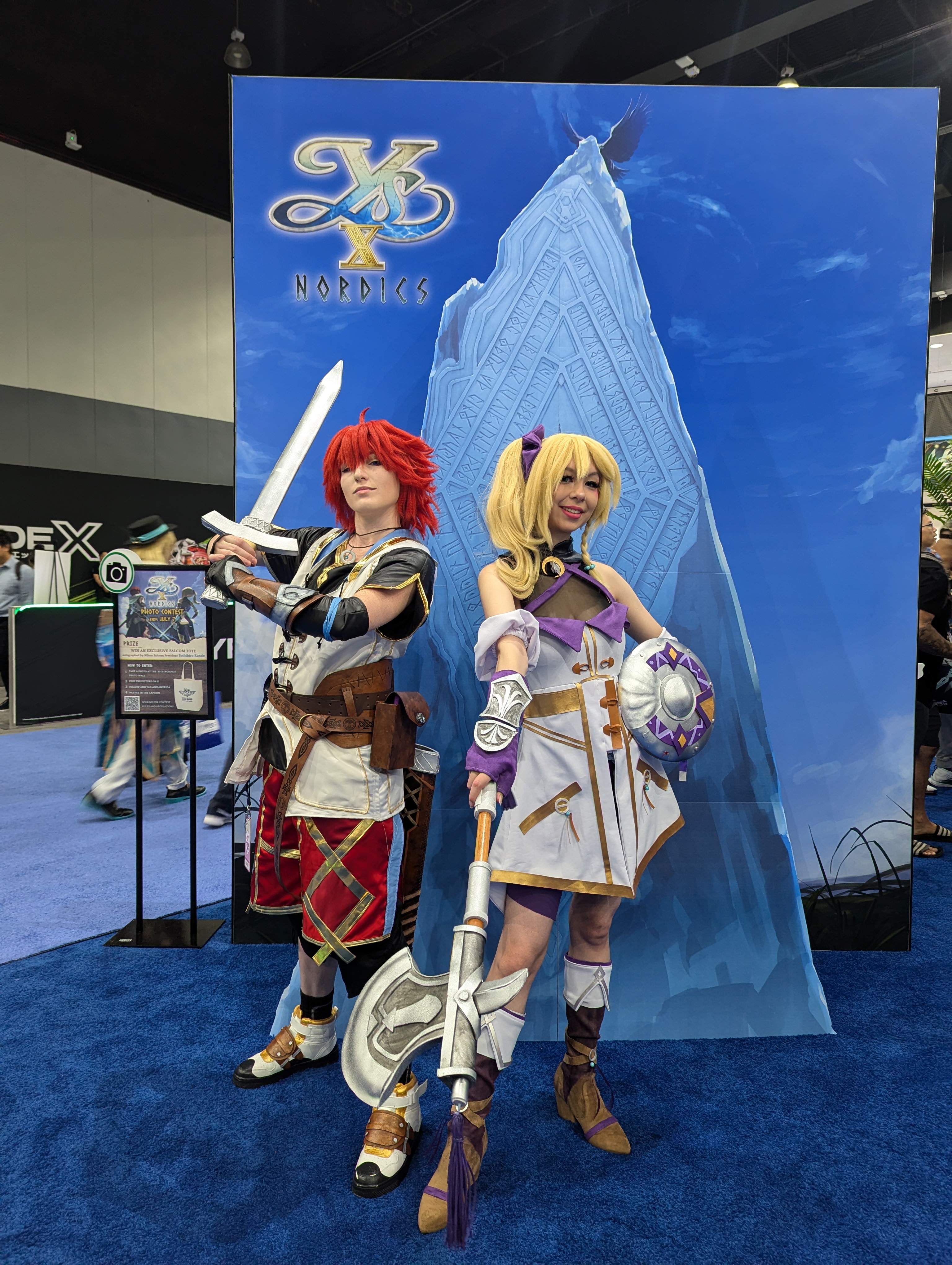 NIS booth with cosplayers