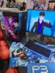 iBUYPOWER booth at Anime Expo displaying prebuilt gaming pcs, feat Persona 3