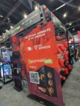 iBUYPOWER booth at Anime Expo displaying prebuilt gaming pcs, feat their mini game