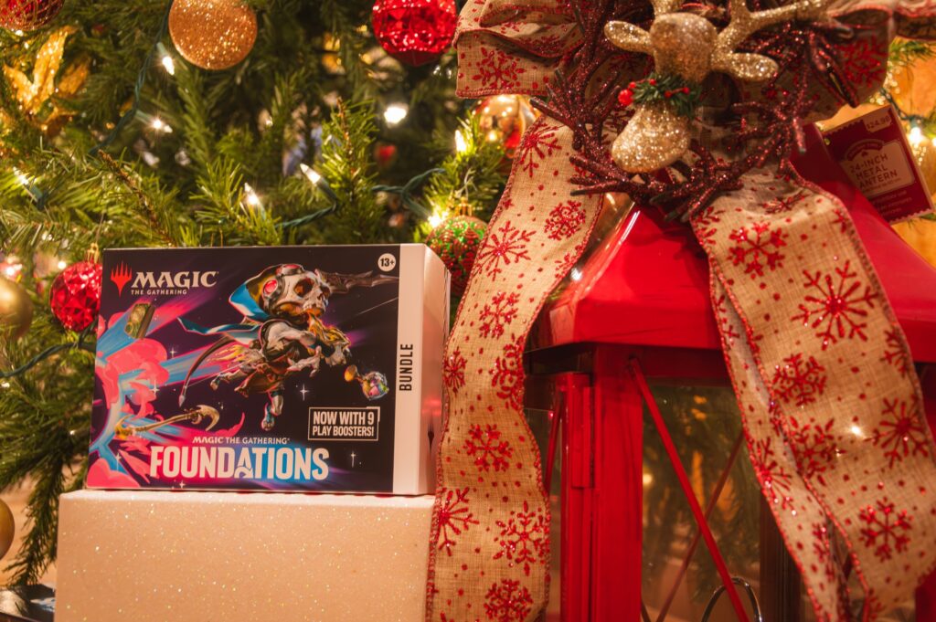 Magic: The Gathering Foundations Bundle around Christmas lights