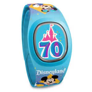 The 70th anniversary MagicBand+- a watch-like accessory with a medallion in the center where a clock face would usually be. This one is light blue with Mickey and Minnie dressed in their 70th celebration outfits on the band and a stylized version of the castle and a "70" in the center.
