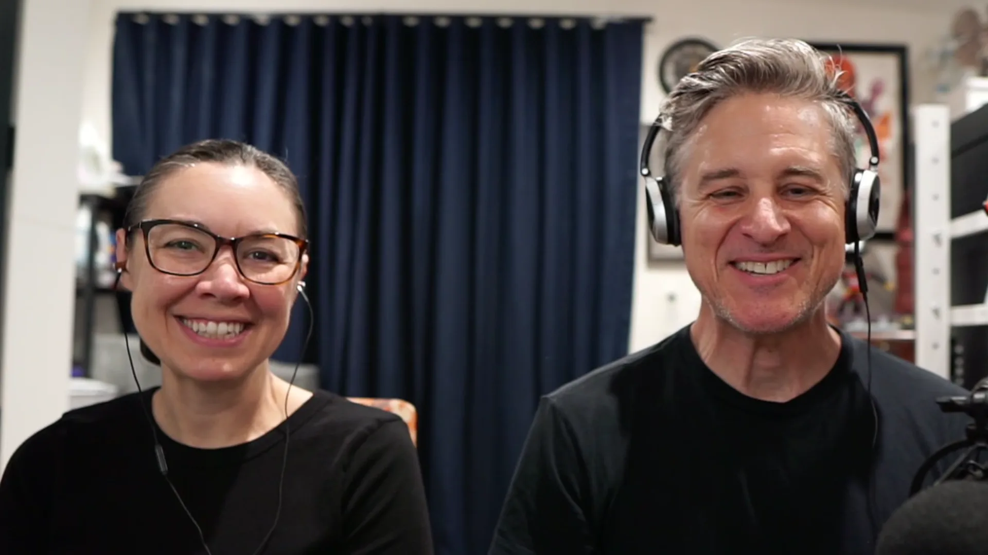 Voice Acting Veterans Yuri Lowenthal and Tara Platt smile at the camera as they are in their home office, speaking virtually to Monica Duarte (off camera) as they discuss the Launch of their Online Voice Acting Course