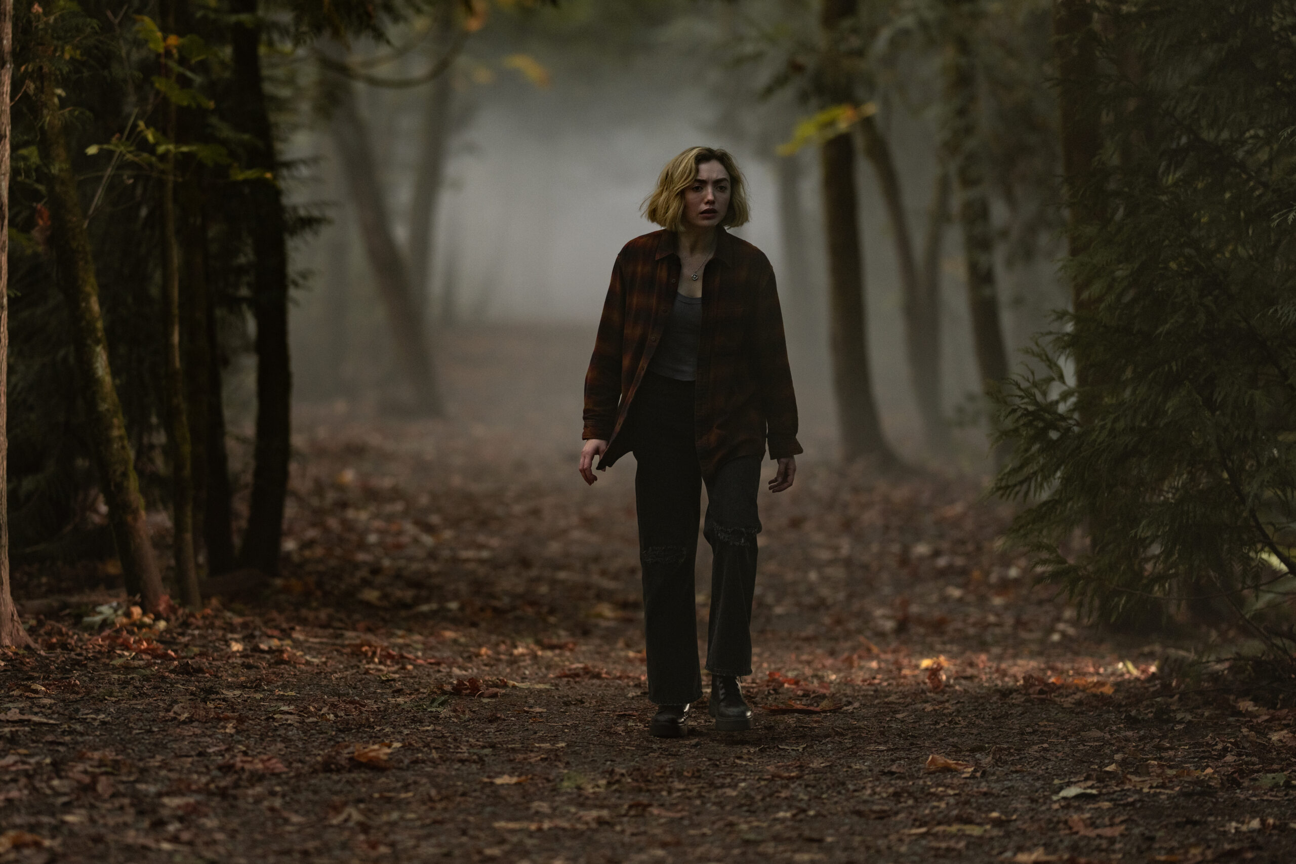 Maddie walks along the forest path (ley lines) looking for Simon.