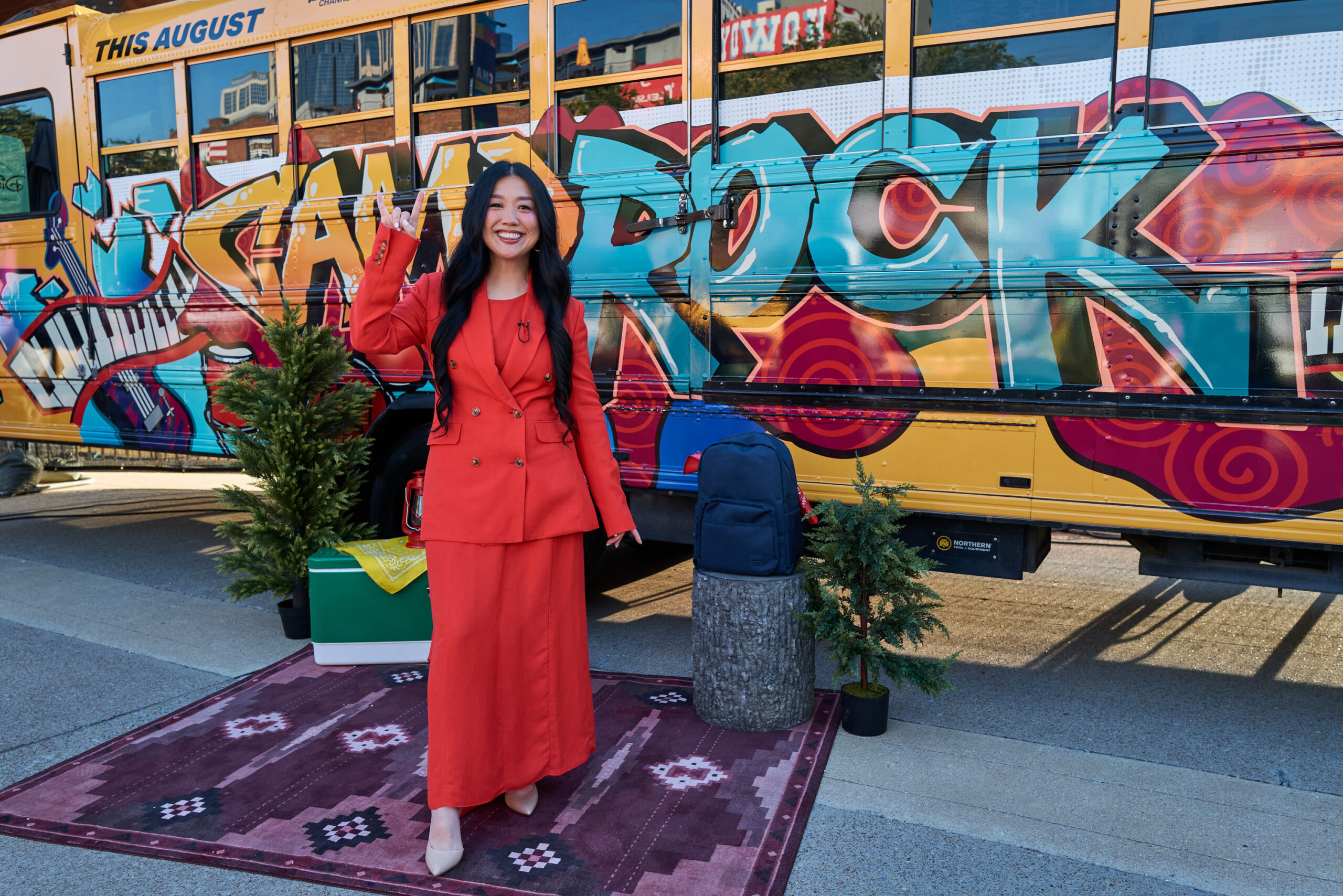 Sherry Cola standing in front of the Camp Rock tour bus